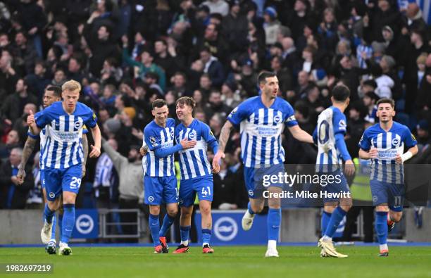 Jack Hinshelwood of Brighton & Hove Albion celebrates scoring his team's second goal with teammate Pascal Gross of Brighton & Hove Albion during the...