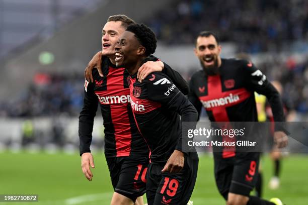 Nathan Tella of Bayer Leverkusen celebrates scoring his team's second goal with teammate Florian Wirtz of Bayer Leverkusen during the Bundesliga...