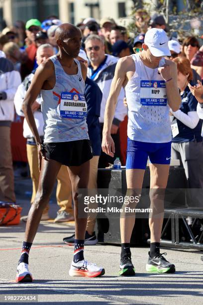 Abdi Abdirahman and Galen Rupp prepare to compete during the 2024 U.S. Olympic Team Trials - Marathon on February 03, 2024 in Orlando, Florida.