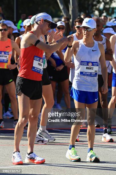 Clayton Young and Conner Mantz prepare to compete during the 2024 U.S. Olympic Team Trials - Marathon on February 03, 2024 in Orlando, Florida.