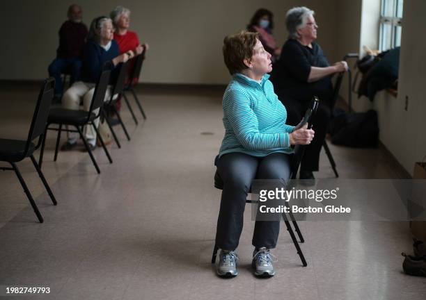 Boston, MA Seniors take part in a chair yoga class at a pop-up senior center.