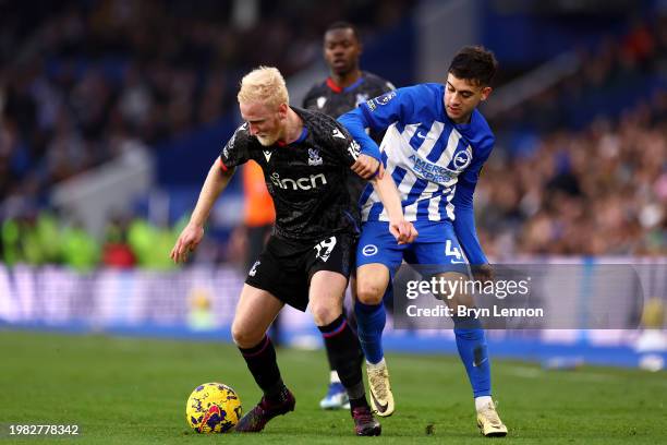 Will Hughes of Crystal Palace is challenged by Facundo Buonanotte of Brighton & Hove Albion during the Premier League match between Brighton & Hove...