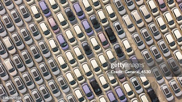 aerial top view of rows of new cars. - car plant aerial stock pictures, royalty-free photos & images