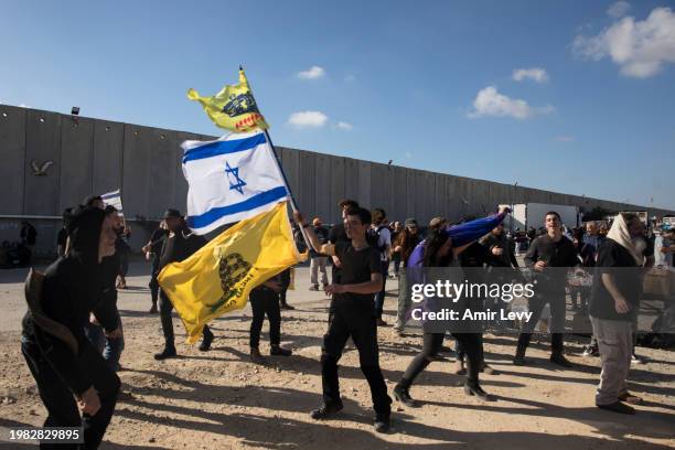 Protesters dance as they block humanitarian aid entering Gaza from Israel on February 6, 2024 in Kerem Shalom, Israel. For several days now, Israeli...