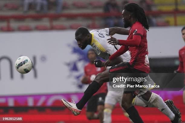 Aka Wilfried Kanga of Standard Liegi competes for the ball with Sarr Mamadou of RWDM Brussels FC during the Jupiler Pro League match between RWDM...