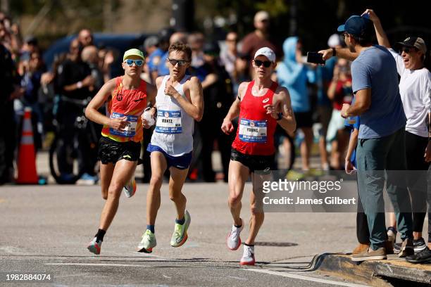 Zachery Panning, Conner Mantz, and Clayton Young run through the course during the 2024 U.S. Olympic Team Trials - Marathon on February 03, 2024 in...