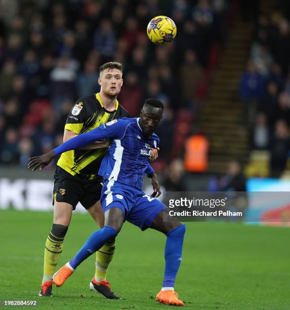 Famara Diedhiou of Cardiff City and Mattie Pollock of Watford during the Sky Bet Championship match between Watford and Cardiff City at Vicarage Road...