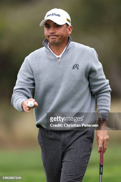 Jason Day of Australia acknowledges the crowd after a putt on the second green during the AT&T Pebble Beach Pro-Am at Pebble Beach Golf Links on...