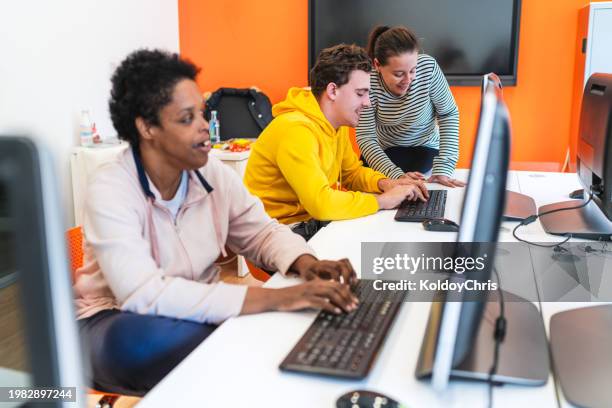 group of happy special needs students taking a break from computers - promises rehab center foto e immagini stock