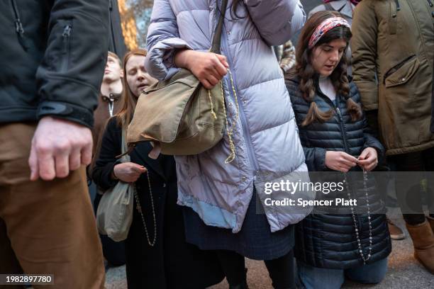 Anti-abortion activists pray near a gathering of abortion-rights demonstrators outside of a Planned Parenthood clinic in downtown Manhattan on...