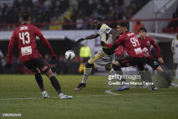 Aka Wilfried Kanga of Standard Liegi competes for the ball with Philipe Sampaio of RWDM Brussels FC during the Jupiler Pro League match between RWDM...