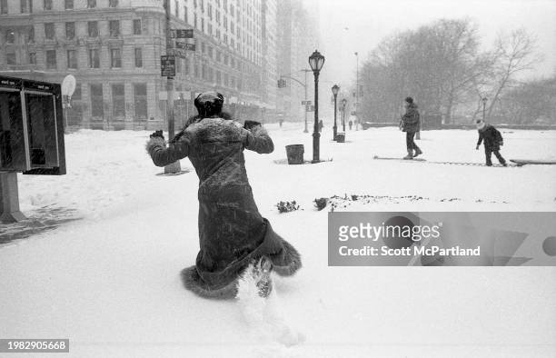 View of a pedestrian struggling to walk in deep snow in Grand Army Plaza during the President's Day blizzard, New York, New York, February 17, 2003.