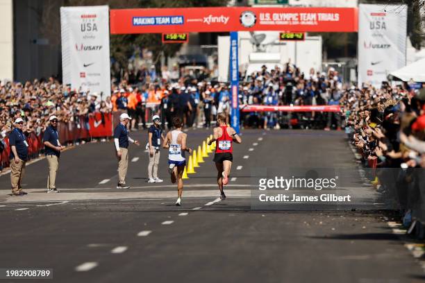 Conner Mantz and Clayton Young run to the finish line during the 2024 U.S. Olympic Team Trials - Marathon on February 03, 2024 in Orlando, Florida.