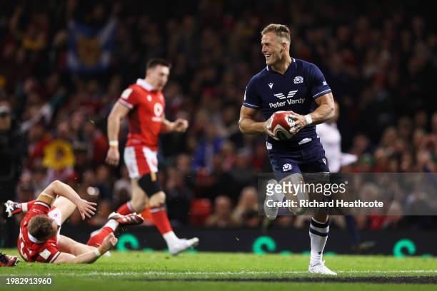 Duhan van der Merwe of Scotland runs to score his team's second try during the Guinness Six Nations 2024 match between Wales and Scotland at...