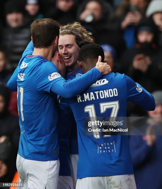 Todd Cantwell of Rangers celebrates after scoring his team's third goal during the Cinch Scottish Premiership match between Rangers FC and Livingston...