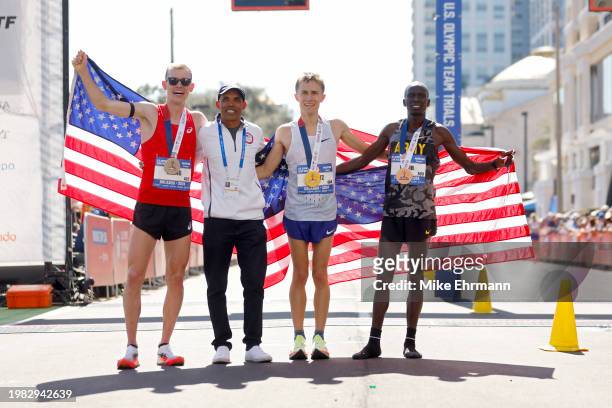 Clayton Young, Meb Keflezighi, Conner Mantz, and Leonard Korir pose for photos after Mantz won the 2024 U.S. Olympic Team Trials - Marathon on...