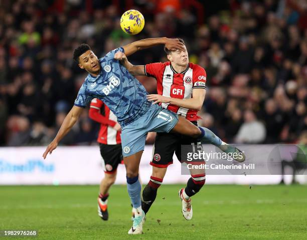 Ollie Watkins of Aston Villa battles for possession with Anel Ahmedhodzic of Sheffield United during the Premier League match between Sheffield...