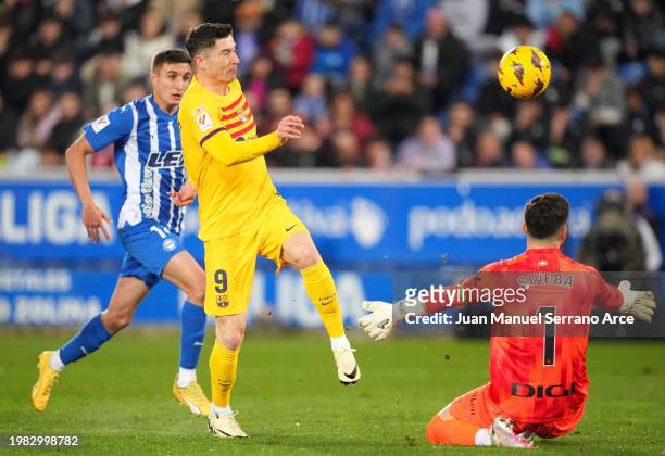 Robert Lewandowski of FC Barcelona scores his team's first goal during the LaLiga EA Sports match between Deportivo Alaves and FC Barcelona at...