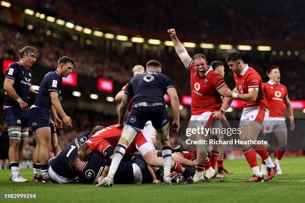 Corey Domachowski of Wales celebrates after James Botham of Wales scores his team's first try during the Guinness Six Nations 2024 match between...