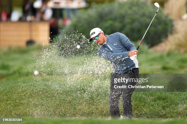 Rickie Fowler of the United States plays a shot from a bunker during the AT&T Pebble Beach Pro-Am at Pebble Beach Golf Links on February 03, 2024 in...