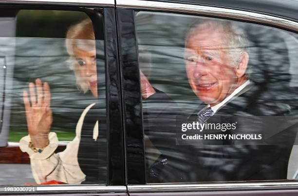 Britain's King Charles III and Britain's Queen Camilla wave as they leave by car from Clarence House in London on February 6, 2024. King Charles...