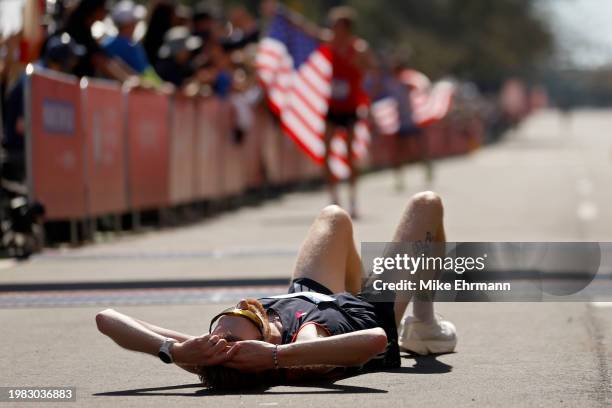 Reed Fischer reacts after crossing the finish line during the 2024 U.S. Olympic Team Trials - Marathon on February 03, 2024 in Orlando, Florida.