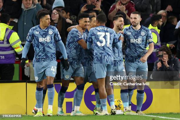 Alex Moreno of Aston Villa celebrates scoring his team's fifth goal with teammates during the Premier League match between Sheffield United and Aston...
