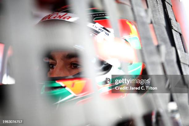 Salvador De Alba, driver of the Aga Red Cola Ford, sits in his car during practice for the NASCAR Mexico Series King Taco La Batalla en El Coliseo at...