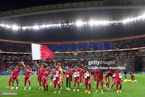 Qatar players celebrates following the team's victory in the AFC Asian Cup quarter final match between Qatar and Uzbekistan at Al Bayt Stadium on...