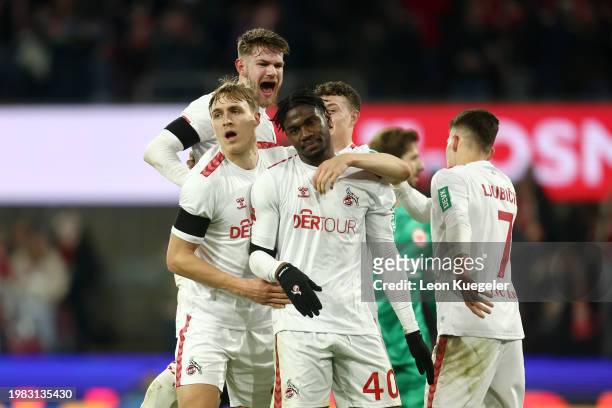 Faride Alidou of 1.FC Köln celebrates scoring his team's first goal with teammates during the Bundesliga match between 1. FC Köln and Eintracht...