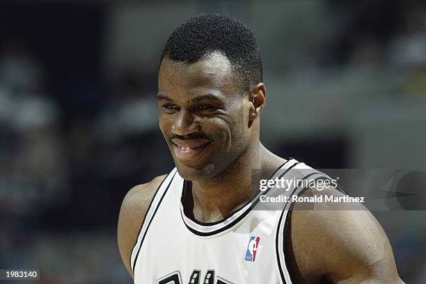 David Robinson of the San Antonio Spurs smiles on the court in Game five of the Western Conference Quarterfinals against the Phoenix Suns during the...