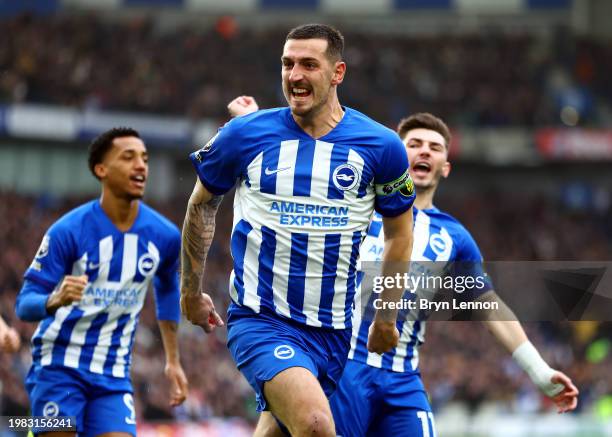 Lewis Dunk of Brighton & Hove Albion celebrates scoring his team's first goal during the Premier League match between Brighton & Hove Albion and...