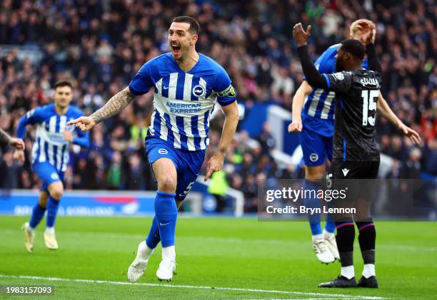 Lewis Dunk of Brighton & Hove Albion celebrates scoring his team's first goal during the Premier League match between Brighton & Hove Albion and...