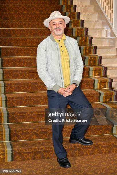 Shoe designer Christian Louboutin poses for the red carpet in the lobby of the Disneyland Hotel during the Disneyland Hotel reopening celebration at...