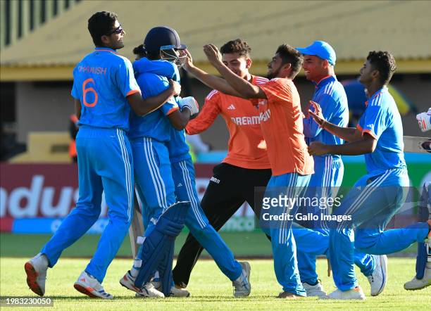 Indian players celebrate their victory over South Africa while South African players show disappointment during the ICC U19 Men's World Cup 2024,...