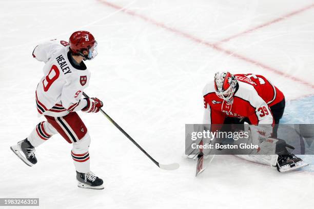 Boston, MA Northeastern goalie Cameron Whitehead makes a save against Harvard defenseman Ryan Healey on a penalty shot in the second period....