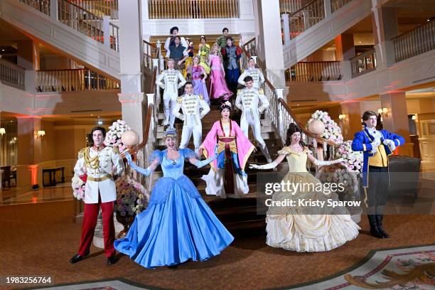 Disney characters Cinderella, Prince Charming, Belle, Prince Adam, Princess Aurora, Prince Philip, Snow White, Rapunzel, Mulan, Princess Tiana,...