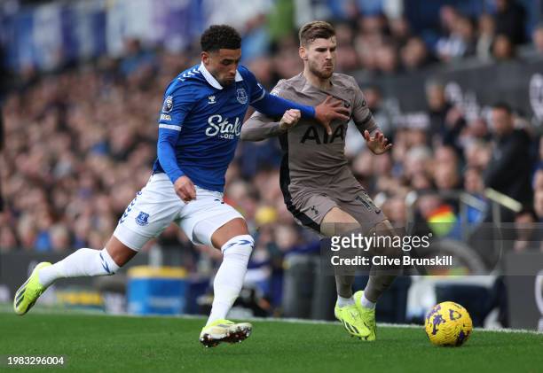 Timo Werner of Tottenham Hotspur is challenged by Ben Godfrey of Everton during the Premier League match between Everton FC and Tottenham Hotspur at...