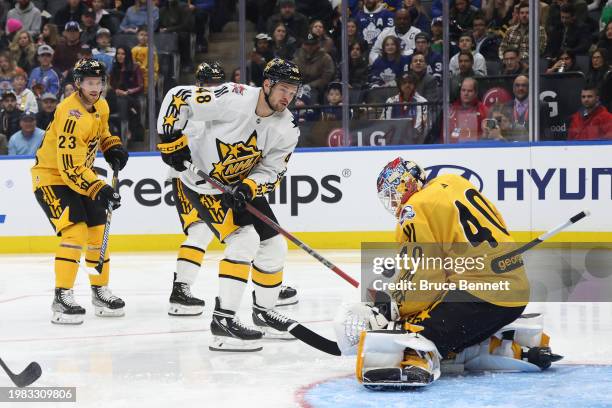 Alexandar Georgiev of the Colorado Avalanche makes a save against Tomas Hertl of the San Jose Sharks during the game between Team Mackinnon and Team...