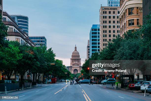 congress avenue leading up to the texas state capitol in austin, tx, usa - austin texas landmarks stock pictures, royalty-free photos & images