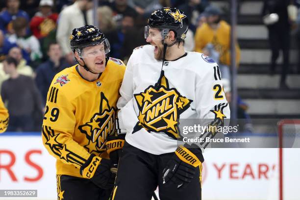 Nathan MacKinnon of the Colorado Avalanche and Leon Draisaitl of the Edmonton Oilers meet after the game between Team Mackinnon and Team McDavid...