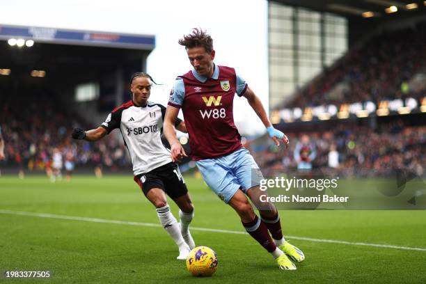 Sander Berge of Burnley runs with the ball whilst under pressure from Bobby Reid of Fulham during the Premier League match between Burnley FC and...