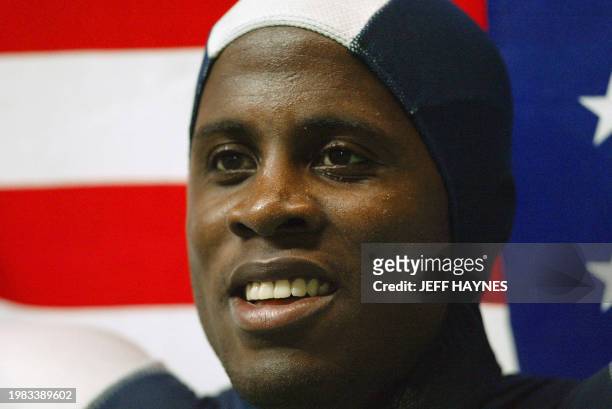 Dwight Phillips of the US smiles after he won gold in the men's long jump, 29 August 2003 during the 9th Athletics World Championships at the Stade...