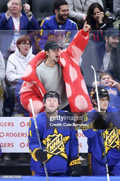 Singer Justin Bieber of team Matthews celebrates a goal during the game between Team Matthews and Team Hughes during the 2024 Honda NHL All-Star Game...