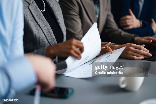 portrait of a beautiful businesswoman working on her laptop computer in the office - inzoomen stockfoto's en -beelden