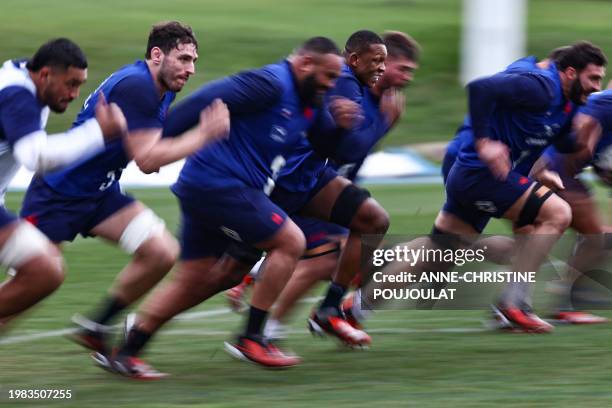 France's lock Cameron Woki and teammates take part in a training session of the French rugby team in Marcoussis, south of Paris, on February 6 as...