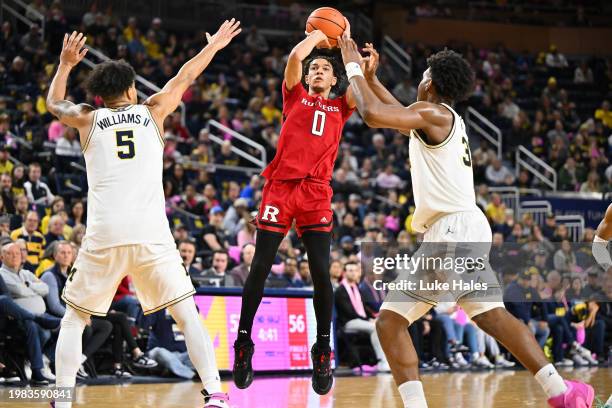 Derek Simpson of the Rutgers Scarlet Knights shoots against the Michigan Wolverines during the second half at Crisler Arena on February 03, 2024 in...