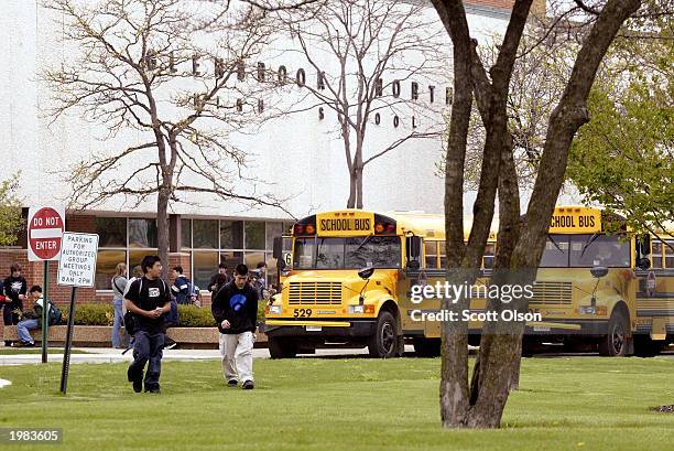 Students leave the campus at Glenbrook North High School May 8, 2003 Northbook, Illinois. Authorities investigating the brutal hazing of girls from...