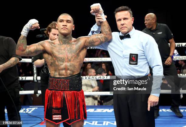 Conor Benn celebrates victory with Referee Thomas Taylor following the welterweight fight between Conor Benn and Peter Dobson at The Cosmopolitan,...