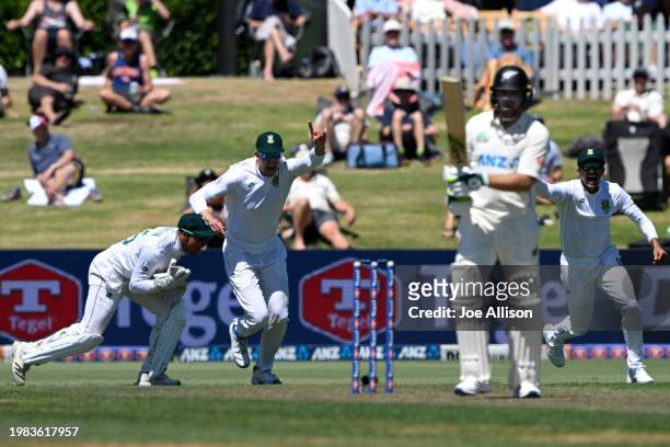 South Africa celebrate after Clyde Fortuin catches the ball to dismiss Tom Latham of New Zealand during day one of the First Test in the series...